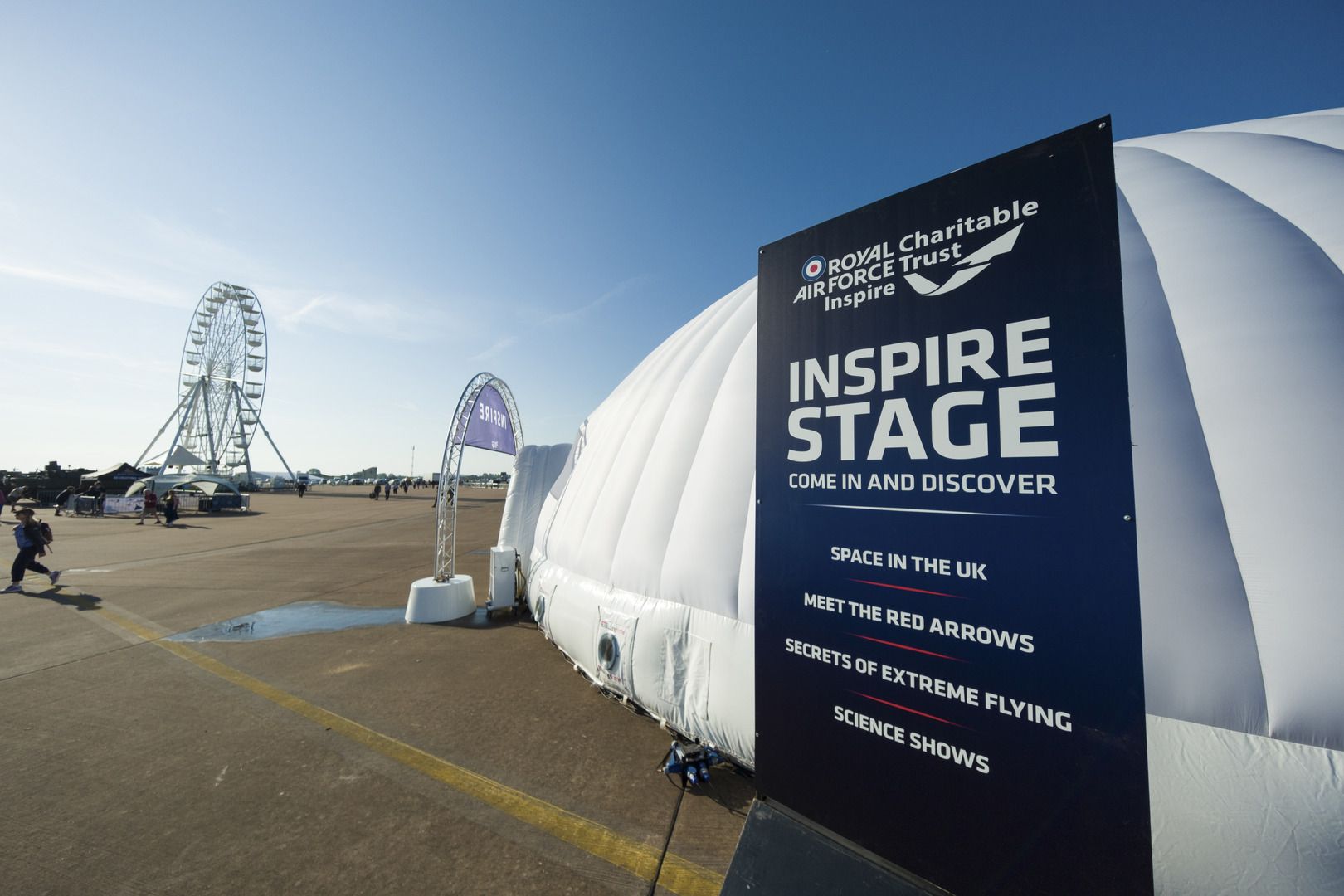 Image taken outside of the Evolution Dome with a sign for The International Air Tattoo's Inspire Stage